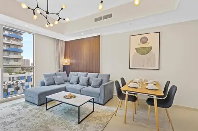 a living room with a couch and a table at Premium 1 bedroom Apartment near Dubai Mall in Dubai
