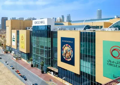 a view of a building with the wvu chicago shield on it at Cozy Studio in JVC in Dubai