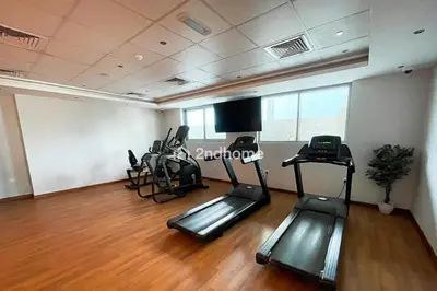 a gym with treadmills and ellipticals in a room at Newly Furnished Unit in Elite, Business Bay in Dubai