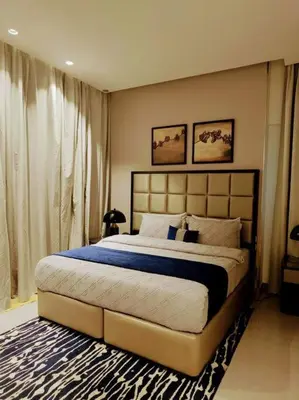 a bedroom with a large bed in a room at Luxury 1BR Majestine Apartment in Dubai