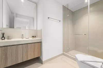 a bathroom with a shower and a sink at Silkhaus Full Burj Khalifa Views in Downtown in Dubai