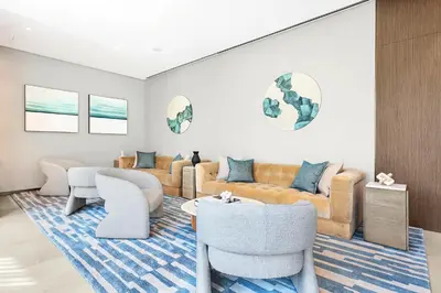 a living room with a couch and chairs at FIRST CLASS 1BR Heart of Tranquility in Dubai