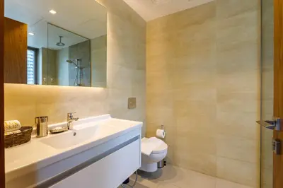 a bathroom with a sink and a toilet at Stunning Marina Waterfront 2 Bed Escape in Dubai