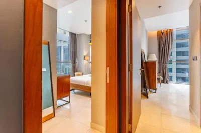 a corridor of a hotel room with a view of a bedroom at Stunning Marina Waterfront 2 Bed Escape in Dubai