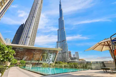 a view of the burj khalifa from a hotel with a swimming pool at FIRST CLASS 1BR Charming City View in Dubai