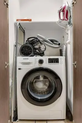 a washer and dryer in a small room at FIRST CLASS 1BR Charming City View in Dubai