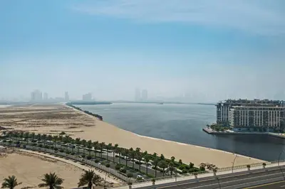 a view of a beach and a body of water at Elegant Apartment for Relaxation, Creek Harbour - By DuStay in Dubai