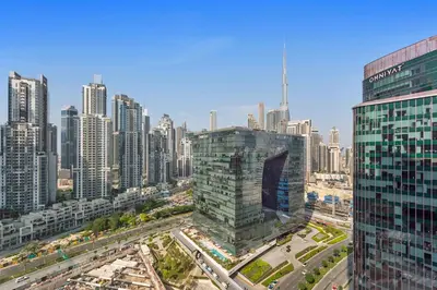 an aerial view of a city with tall buildings at Stunning 1 bedroom Apartment w Burj Khalifa View in Dubai