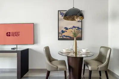 a dining room with a table and chairs at GuestReady - Luxurious studio in Business Bay in Dubai