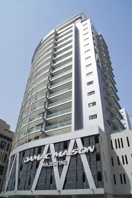a tall building with aania sign on the side of it at GuestReady - Luxurious studio in Business Bay in Dubai