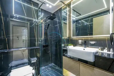 a bathroom with a sink and a shower at Modern 1BR Apartment in Binghatti Luna, Jumeirah Village Circle by Deluxe Holiday Homes in Dubai
