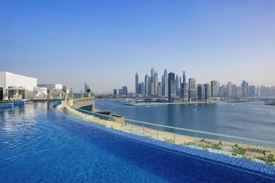 a large body of water with a city in the background at Exquisite Studio near Nakheel Mall by Livbnb in Dubai