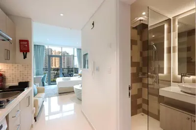a bathroom with a sink and a shower in a room at Exquisite Studio near Nakheel Mall by Livbnb in Dubai