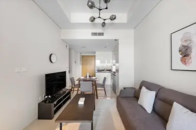 a living room with a couch and a table at Modern 2-Bedroom Apartment in Aykon Tower C in Dubai