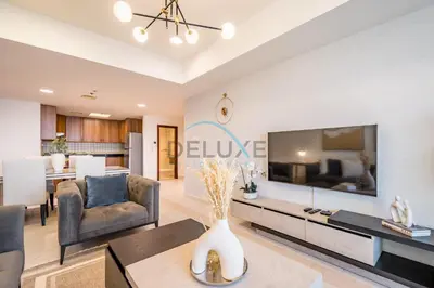 a living room with a large flat screen tv at Panoramic 2BR Apartment in Princess Tower, Dubai Marina by Deluxe Holiday Homes in Dubai