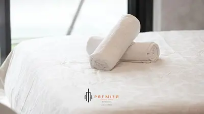 a roll of toilet paper sitting on top of a bed at PREMIER STUDIO I Poolside in Dubai