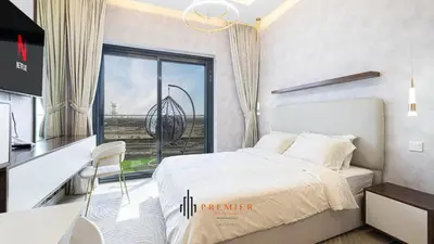 a bedroom with a bed and a large window at PREMIER STUDIO I Poolside in Dubai