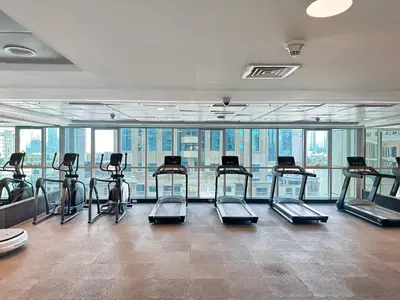 a gym with a bunch of exercise bikes in a room at Trophy Starlight Suites Lux Upgraded 1BR in Marina in Dubai
