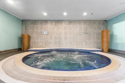 a large pool of water in a room at Elegant One Bed Apartment - Panoramic Marina Views - Near JBR & Beach in Dubai