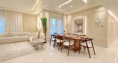 a living room with a table and chairs and a couch at Usmans 4 Bedroom Apartment on D Beach By SLS DIRECT BEACH ACCESS FULLY SERVICED JBR in Dubai