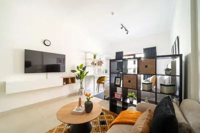 a living room with a couch and a table at Frank Porter - G24 Tower in Dubai