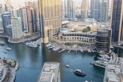 an aerial view of a city with boats in a river at 2 Bedroom Apartment at Bahar 1 JBR by TSHH in Dubai