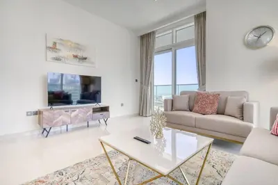 a living room with a couch and a table at New 2 bedroom full sea view in Dubai