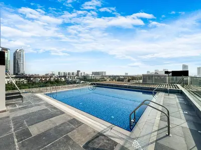 a swimming pool on the roof of a building at Stylish Contemporary Home in JVC with Chic Interior in Dubai