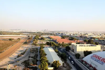 an aerial view of a city with a highway at Chic Aykon City 2-Bedroom Retreat - Business Bay in Dubai