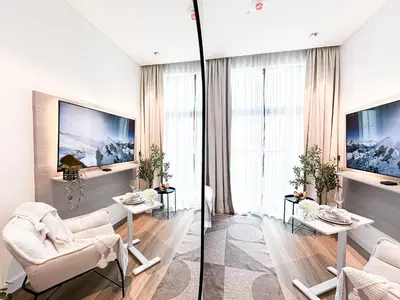 a living room with two chairs and a table at Modern Marvel Studio in Business Bay in Dubai
