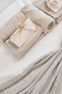 a set of towels with a napkin and a box at Apartment in Downtown Dubai in Dubai