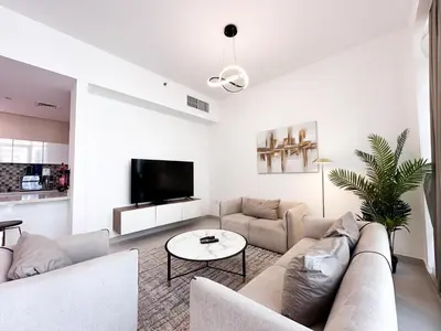 a living room with a couch and a table at Luxurious 2BR in Vezul Residence, Business Bay - 13AB01 in Dubai