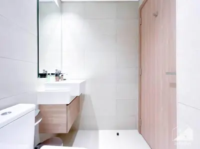 a bathroom with a toilet and a sink and a mirror at Amazing Studio with Balcony & View Riviera Meydan in Dubai