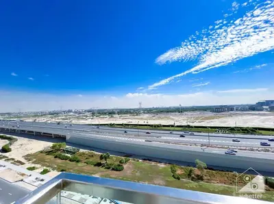 an overhead view of a highway with cars on it at Amazing Studio with Balcony & View Riviera Meydan in Dubai