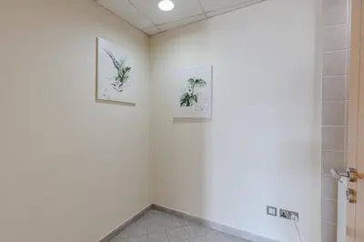 a bathroom with two pictures on the wall at Spacious 3BDR Apartment in Marina with Office in Dubai