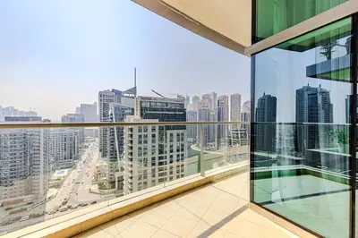 a balcony with a view of a city skyline at Spacious 3BDR Apartment in Marina with Office in Dubai