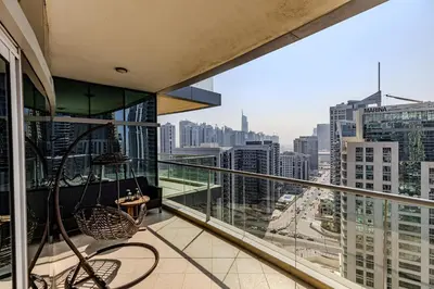 a balcony with a view of a city at Spacious 3BDR Apartment in Marina with Office in Dubai