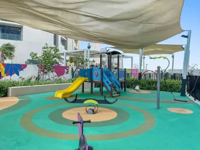 a playground with a slide and a play structure at Silkhaus New Modern Studio In New Tower at Business Bay in Dubai