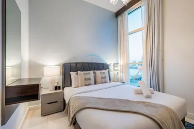 a bedroom with a large bed and a window at Stunning 3BR Apartment in Bayz Tower, Business Bay by Deluxe Holiday Homes in Dubai