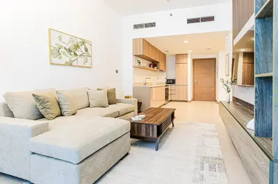 a living room with a couch and a table at 1BR Apt Residence Along Business Bay Canal in Dubai