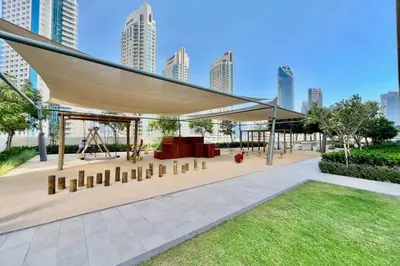 a pavilion in a city with tall buildings at Glow Sky Suite Trendy 1BR- Dubai Mall Access by Maxx Value Homes in Dubai