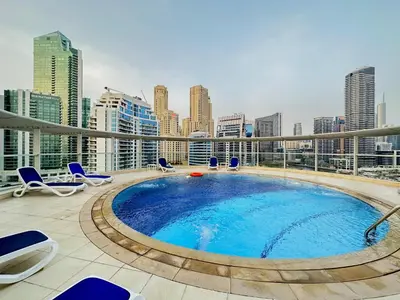 a swimming pool on the roof of a building at Unforgettable View & Experience Over Dubai Canal in Dubai