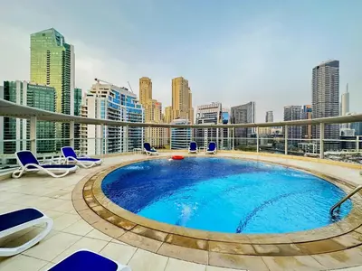 a swimming pool on the roof of a building at Unforgettable View & Experience Over Dubai Canal in Dubai
