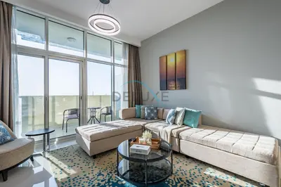 a living room with a couch and a table at Elegant 2BR in Tower 108 Jumeirah Village Circle by Deluxe Holiday Homes in Dubai