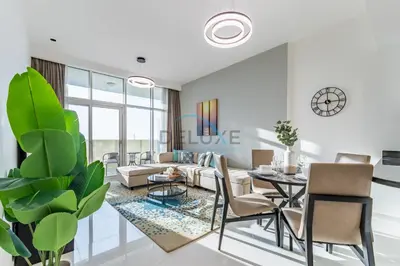 a living room with a couch and a table at Elegant 2BR in Tower 108 Jumeirah Village Circle by Deluxe Holiday Homes in Dubai