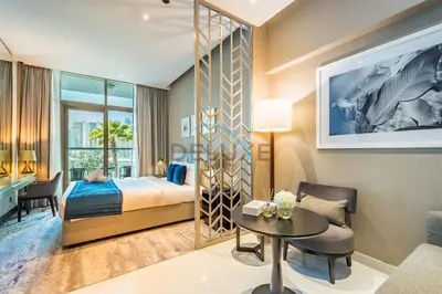 a hotel room with a bed and a desk at Luxury Studio Apartment in Prive By Damac B, Business Bay by Deluxe Holiday Homes in Dubai