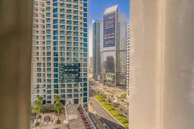 a view of a city skyline with tall buildings at Escape24 Cozy Studio with Pool & Canal View near Burj Khalifa in Dubai