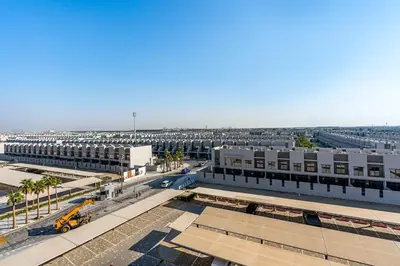 an aerial view of a city with buildings at Lovely Studio in Mag 900, Meydan in Dubai