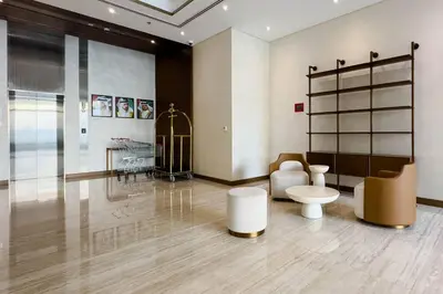a large room with a table and a toilet at Naseem Elegant Studio Escape in Al Merkadh in Dubai