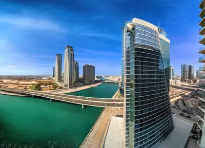 a view of a city with a river and a bridge at Luxury 3BD study in Missoni with private elevator in Dubai
